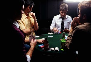 men-playing-poker-young-man-selecting-chips-200169347-005-57b4a8365f9b58b5c2eeffe0